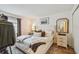Cozy bedroom featuring a comfortable bed, a nightstand, and stylish decor at 310 S Delaware Ave # F, Tampa, FL 33606