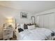 Bedroom featuring a comfortable bed, a nightstand, and minimalist decor at 310 S Delaware Ave # F, Tampa, FL 33606