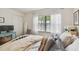 Inviting bedroom with a window and sheer curtains, offering a relaxing and airy atmosphere at 310 S Delaware Ave # F, Tampa, FL 33606