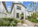 Inviting townhome with a well-maintained front yard, black front door, and a pleasant curb appeal at 310 S Delaware Ave # F, Tampa, FL 33606