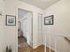 Hallway with wood flooring, featuring access to a bedroom and closet space at 310 S Delaware Ave # F, Tampa, FL 33606
