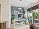 Bright home office with large window, desk, and view of outdoor greenery at 310 S Delaware Ave # F, Tampa, FL 33606