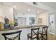 Modern kitchen featuring a breakfast bar and decorative dishware on display at 310 S Delaware Ave # F, Tampa, FL 33606