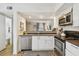 Charming kitchen featuring stainless steel appliances, a stove, and a stylish backsplash at 310 S Delaware Ave # F, Tampa, FL 33606