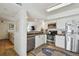 Kitchen featuring stainless appliances and a view into the nearby living room at 310 S Delaware Ave # F, Tampa, FL 33606
