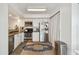Kitchen featuring stainless steel appliances, white cabinetry, and a stylish rug at 310 S Delaware Ave # F, Tampa, FL 33606
