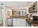 Charming kitchen featuring stainless steel appliances, a stove, and a stylish backsplash at 310 S Delaware Ave # F, Tampa, FL 33606