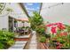 Outdoor patio with lush tropical landscaping, perfect for relaxing and entertaining at 310 S Delaware Ave # F, Tampa, FL 33606