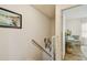 Stairwell featuring view of adjacent room and second floor at 310 S Delaware Ave # F, Tampa, FL 33606