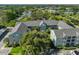 An aerial view captures the building's layout, complemented by trees and the surrounding neighborhood at 330 Promenade Dr # 206, Dunedin, FL 34698