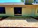 Paved brick patio area with sliding glass doors, offering seamless indoor-outdoor living at 3529 Tanglewood Trl, Palm Harbor, FL 34685