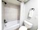 Bathroom with a tiled shower, shower curtain and modern fixtures at 3529 Tanglewood Trl, Palm Harbor, FL 34685