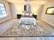 Bright bedroom featuring a decorative rug, great lighting, and a ceiling fan at 3529 Tanglewood Trl, Palm Harbor, FL 34685
