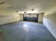 Spacious garage with sealed floor offering ample parking and storage space at 3529 Tanglewood Trl, Palm Harbor, FL 34685