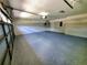 Oversized garage with ample storage space, sealed floors, and great lighting at 3529 Tanglewood Trl, Palm Harbor, FL 34685