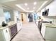 Spacious, renovated kitchen features stainless steel appliances, granite countertops and modern cabinetry at 3529 Tanglewood Trl, Palm Harbor, FL 34685