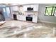 This remodeled kitchen features granite countertops, stainless appliances and new flooring at 3529 Tanglewood Trl, Palm Harbor, FL 34685