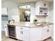 Kitchen features granite countertops, wine rack, modern appliances and hardware at 3529 Tanglewood Trl, Palm Harbor, FL 34685