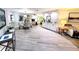 Open concept living area featuring wood-look floors, fireplace, and natural light at 3529 Tanglewood Trl, Palm Harbor, FL 34685