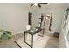 Cozy office space with barn doors, large windows and a ceiling fan at 3529 Tanglewood Trl, Palm Harbor, FL 34685