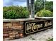 Tarpon Woods neighborhood sign with manicured landscaping and stone base at 3529 Tanglewood Trl, Palm Harbor, FL 34685