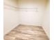 Walk-in closet with wire shelving and ample space for storage at 3529 Tanglewood Trl, Palm Harbor, FL 34685