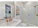 Bathroom featuring marble counters, shower, modern fixtures and doorway to bedroom at 3905 W San Obispo St, Tampa, FL 33629