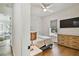 Bedroom features hardwood floors, neutral decor, and a view into the living room at 3905 W San Obispo St, Tampa, FL 33629