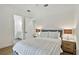Bedroom features hardwood floors and neutral decor with a view into bathroom at 3905 W San Obispo St, Tampa, FL 33629