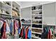 Organized closet featuring hanging clothes, shelves for shoes, handbags and other items at 3905 W San Obispo St, Tampa, FL 33629
