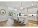 Open kitchen featuring island with counter seating and pendant lighting at 3905 W San Obispo St, Tampa, FL 33629