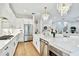 Spacious kitchen with white marble countertops, stainless steel appliances, and stylish lighting at 3905 W San Obispo St, Tampa, FL 33629