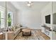 Cozy living room with a comfortable sectional sofa, round coffee table, and bright, natural light at 3905 W San Obispo St, Tampa, FL 33629