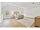 Spacious main bedroom with tray ceiling, neutral decor, and wood flooring at 3905 W San Obispo St, Tampa, FL 33629