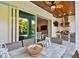 Covered patio with a well-equipped outdoor kitchen, dining area, and view of the pool at 3905 W San Obispo St, Tampa, FL 33629