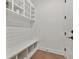 Well-organized pantry featuring shelving, bench, and storage compartments at 3905 W San Obispo St, Tampa, FL 33629