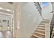 Beautiful staircase featuring shiplap accent wall and modern railing at 3905 W San Obispo St, Tampa, FL 33629