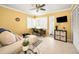 Bright bedroom with tile flooring, a modern desk, and natural light streaming through windows at 40 Pine Lake Dr, Oldsmar, FL 34677