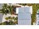 Aerial view of the home featuring the roof and a cozy patio with furniture at 412 80Th St, Holmes Beach, FL 34217
