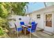 Private backyard patio with an inviting fire pit and ample seating, ideal for outdoor entertaining and relaxation at 412 80Th St, Holmes Beach, FL 34217
