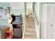 Finished basement with game room and a staircase with white risers and wooden railing at 412 80Th St, Holmes Beach, FL 34217