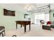 Basement game room features a foosball table, entertainment area, and finished ceilings at 412 80Th St, Holmes Beach, FL 34217