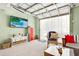 Finished basement with lounge area, decorative accents, sheer curtains, and carpet at 412 80Th St, Holmes Beach, FL 34217