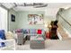 Finished basement game area with arcade game, staircase, and comfortable seating at 412 80Th St, Holmes Beach, FL 34217