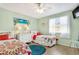 Bright bedroom with two twin beds, beach-themed decor, and a comfortable atmosphere at 412 80Th St, Holmes Beach, FL 34217