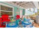 Inviting deck with outdoor dining area, ideal for enjoying meals with views of Anna Maria Island at 412 80Th St, Holmes Beach, FL 34217