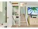 Inviting entryway with stairs leading to the lower level and an open view to the living area at 412 80Th St, Holmes Beach, FL 34217