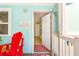 Open doorway to a charming beach house, inviting guests to explore the island paradise at 412 80Th St, Holmes Beach, FL 34217