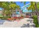 Charming beach house with lush landscaping and a welcoming front porch, perfect for island living at 412 80Th St, Holmes Beach, FL 34217