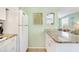Bright kitchen with granite countertops open to a living area, perfect for entertaining at 412 80Th St, Holmes Beach, FL 34217